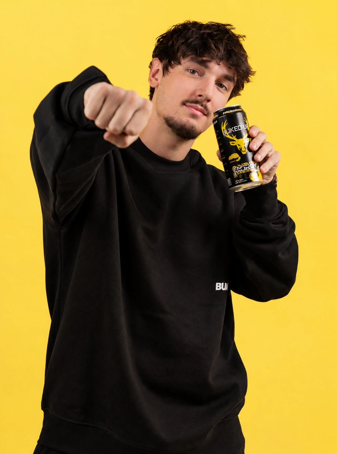 Studio content featuring a male creator holding a product